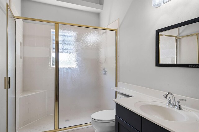 16017 Harbar Oaks Dr, Montverde, FL 34756 - bathroom featuring a shower stall, toilet, and vanity