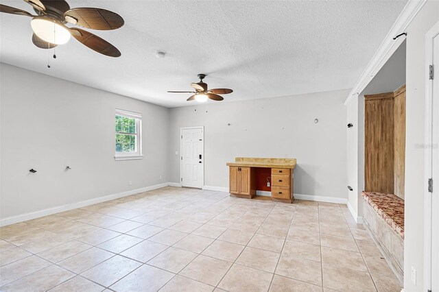16017 Harbar Oaks Dr, Montverde, FL 34756 - spare room with ceiling fan, light tile patterned flooring, a textured ceiling, and baseboards