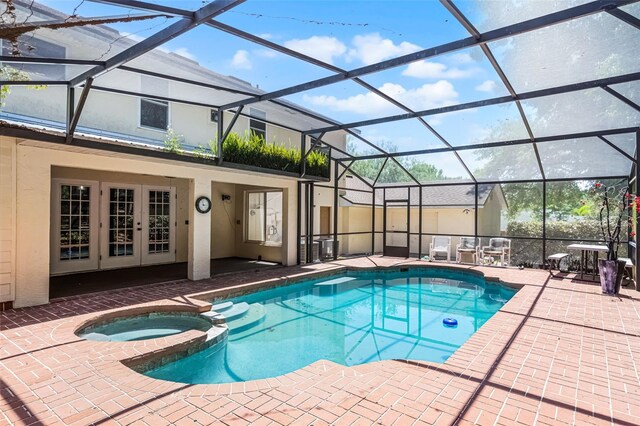 16017 Harbar Oaks Dr, Montverde, FL 34756 - view of pool featuring a patio, a pool with connected hot tub, french doors, and a lanai