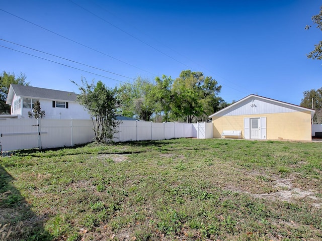 view of yard with a fenced backyard