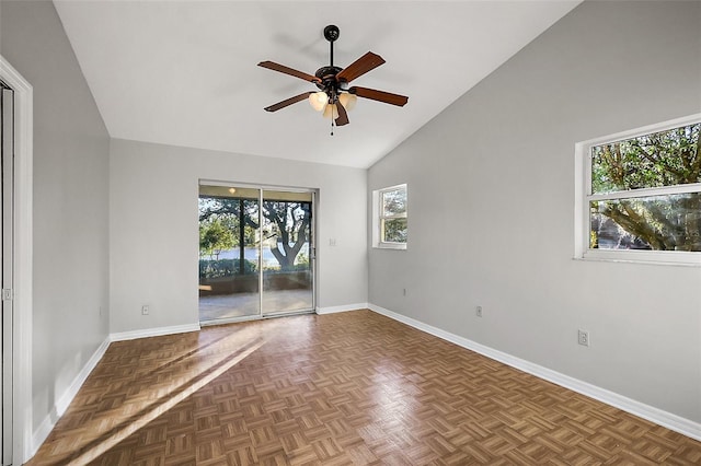 unfurnished room with high vaulted ceiling, ceiling fan, and baseboards