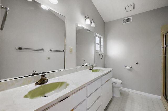 full bath with visible vents, a sink, toilet, and double vanity