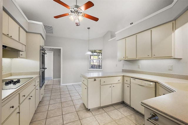 kitchen featuring cream cabinets, white dishwasher, cooktop, and visible vents