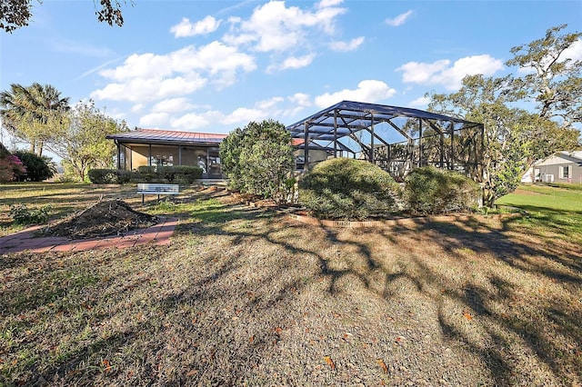 view of yard featuring a lanai