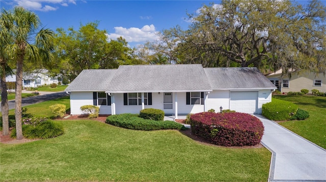 single story home with a garage, a porch, concrete driveway, and a front lawn