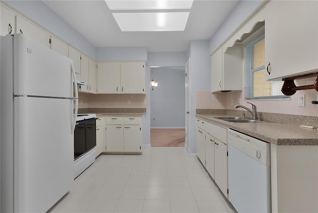 kitchen featuring a sink, backsplash, white appliances, light tile patterned floors, and baseboards