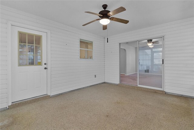 interior space featuring a ceiling fan