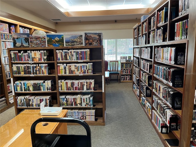 interior space with visible vents and bookshelves