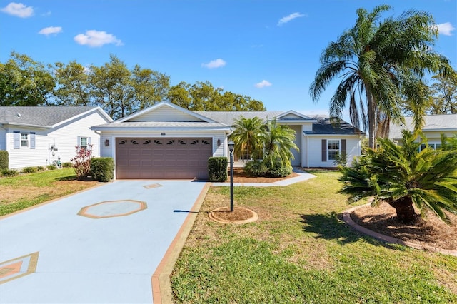 single story home with a front lawn, driveway, and an attached garage