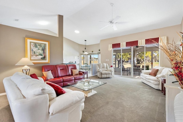 living room featuring ceiling fan, vaulted ceiling, carpet flooring, and visible vents