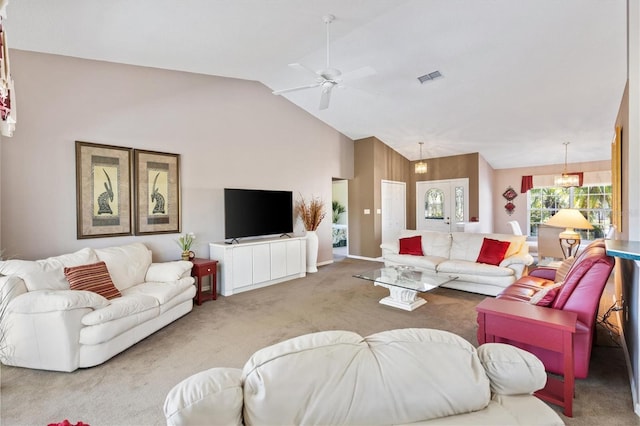 carpeted living area with lofted ceiling, ceiling fan, and visible vents