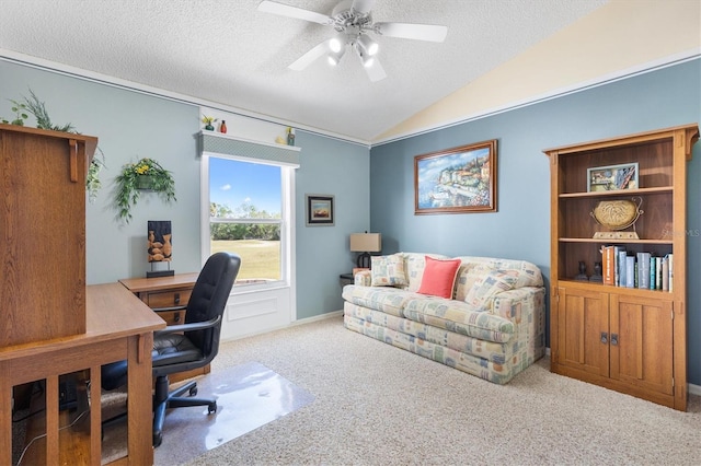 carpeted office with a ceiling fan, vaulted ceiling, and a textured ceiling