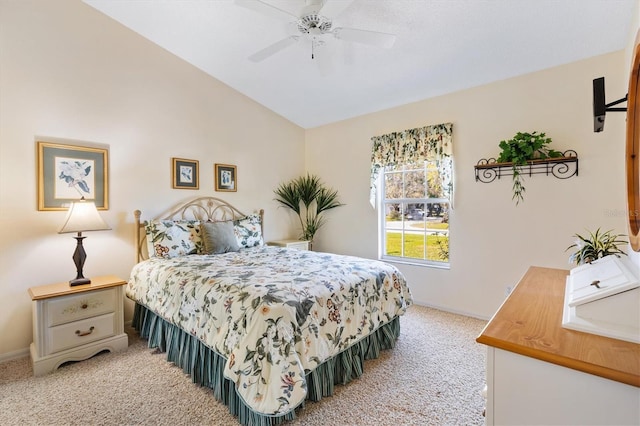 bedroom featuring lofted ceiling, ceiling fan, light carpet, and baseboards