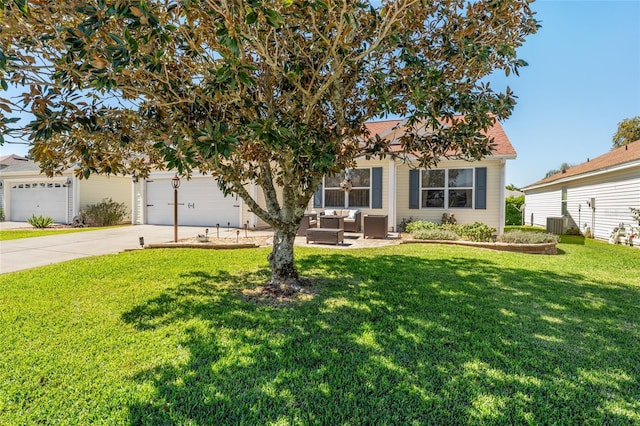 obstructed view of property featuring a garage, a front yard, concrete driveway, and central air condition unit