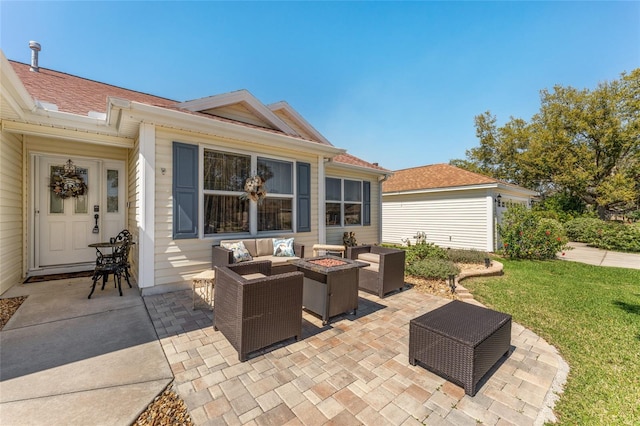 view of patio featuring an outdoor living space with a fire pit