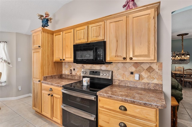 kitchen with double oven range, black microwave, decorative backsplash, and light tile patterned flooring