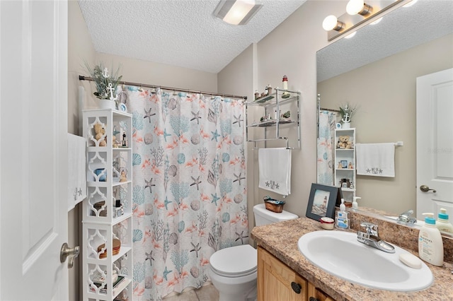 bathroom with a textured ceiling, a shower with shower curtain, vanity, and toilet