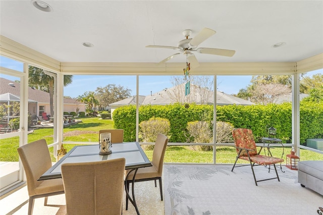 sunroom with ceiling fan and a wealth of natural light