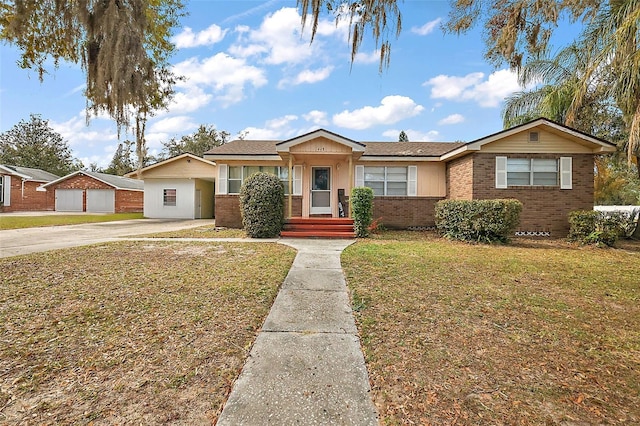 single story home with brick siding and a front lawn