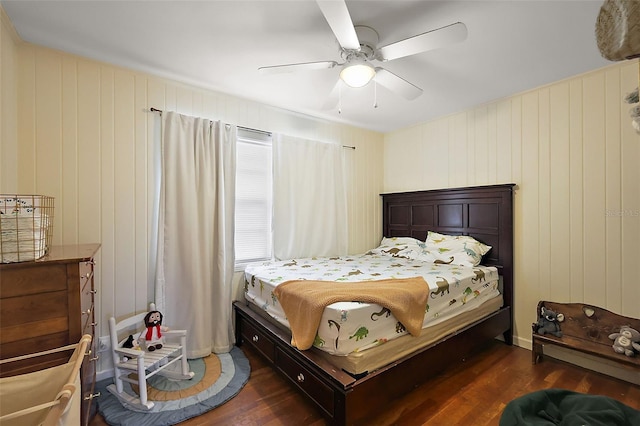 bedroom featuring a ceiling fan and dark wood finished floors