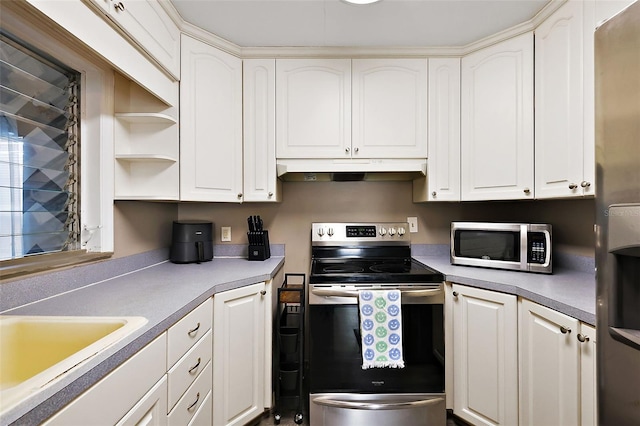 kitchen featuring appliances with stainless steel finishes, white cabinets, a sink, and under cabinet range hood