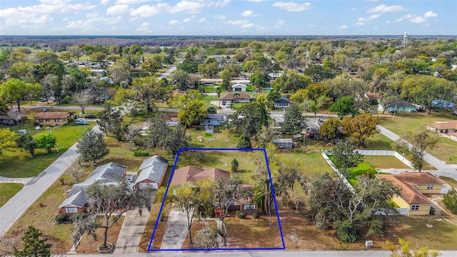 birds eye view of property with a residential view