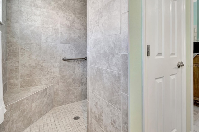 full bathroom with a tile shower