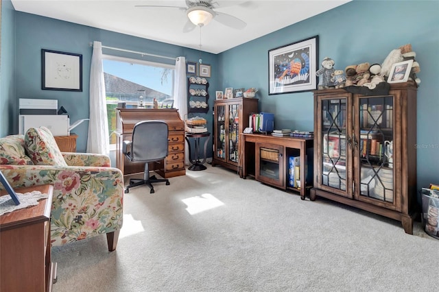 office featuring a ceiling fan and carpet floors