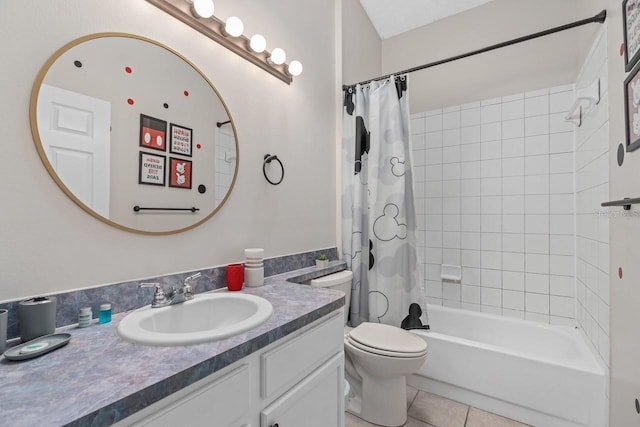 bathroom featuring shower / bath combo with shower curtain, vanity, toilet, and tile patterned floors