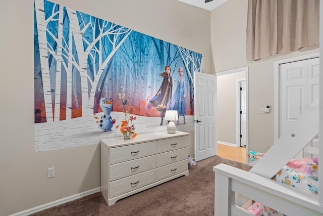 carpeted bedroom featuring baseboards