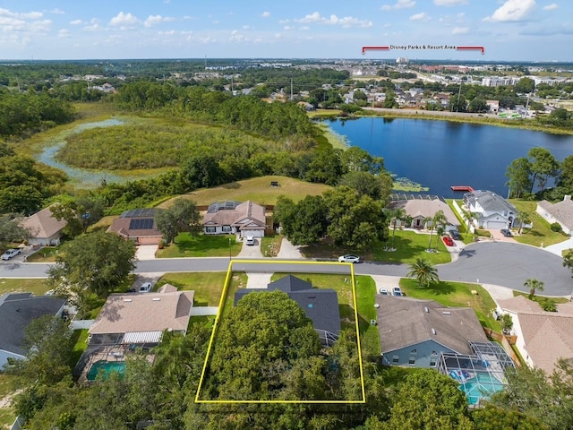 bird's eye view featuring a water view and a residential view