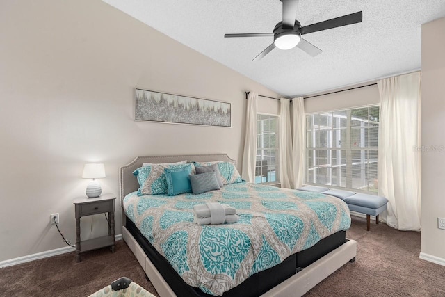 bedroom featuring baseboards, lofted ceiling, ceiling fan, carpet, and a textured ceiling