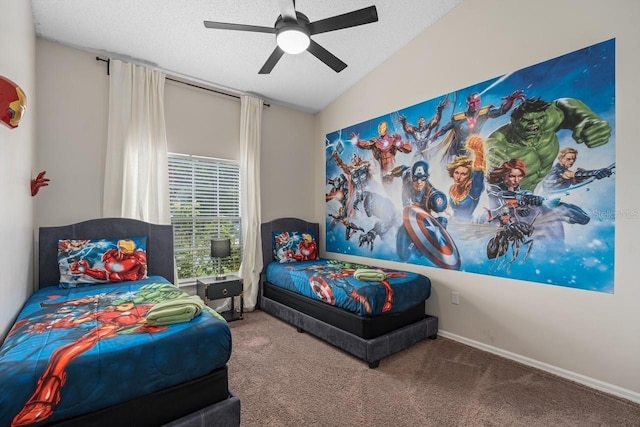 bedroom with lofted ceiling, a textured ceiling, carpet flooring, and a ceiling fan