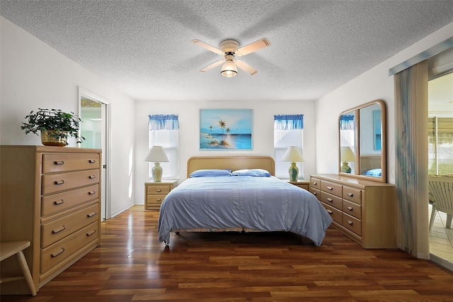 bedroom with dark wood-style flooring and a textured ceiling