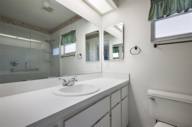 full bath with toilet, visible vents, and vanity