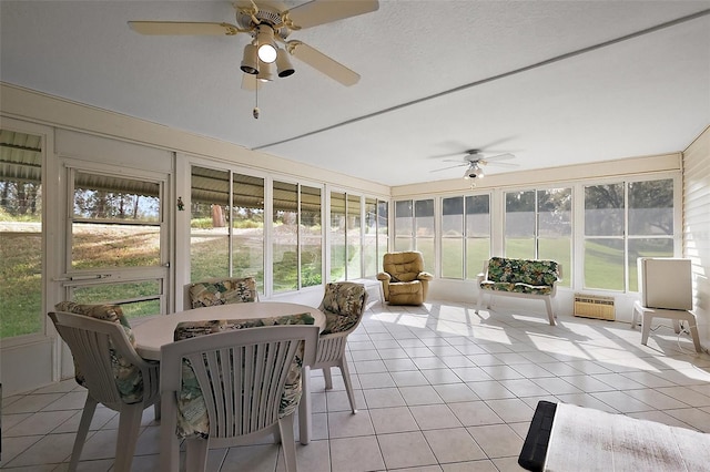 sunroom featuring a ceiling fan and a wealth of natural light