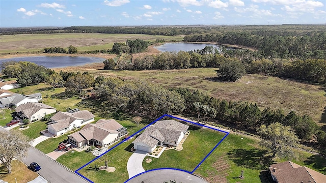 aerial view with a water view and a residential view