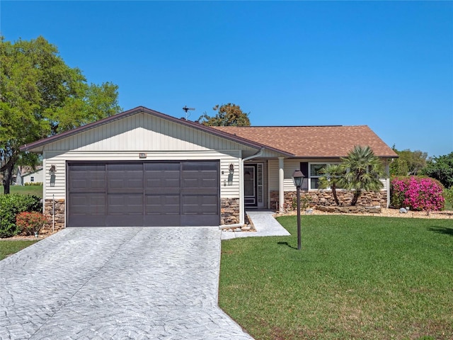 view of front of home featuring driveway, an attached garage, a shingled roof, a front lawn, and stone siding