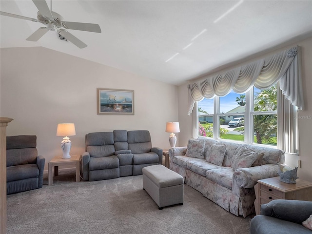 carpeted living area with lofted ceiling and a ceiling fan