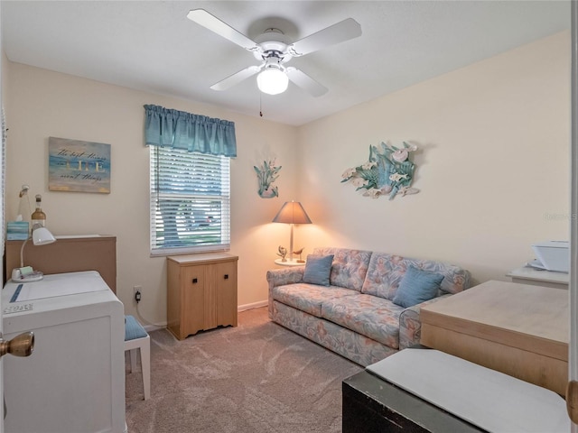 carpeted living area featuring a ceiling fan