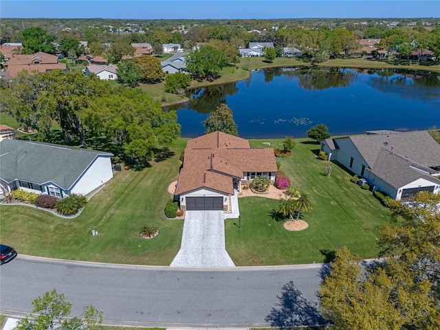 bird's eye view featuring a residential view and a water view