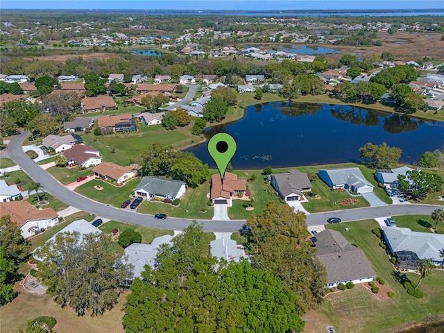 drone / aerial view with a residential view and a water view