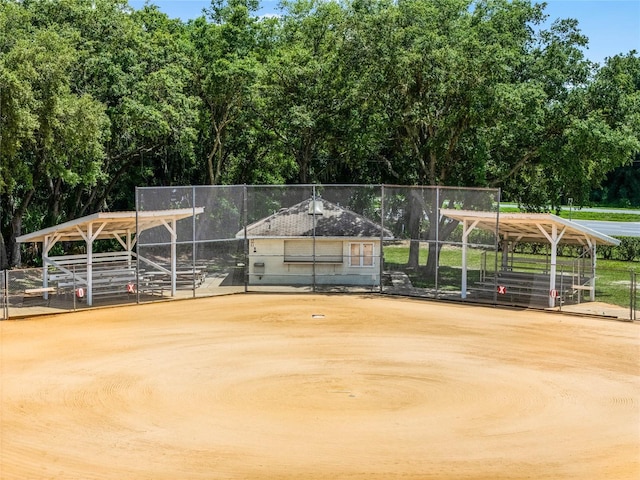 surrounding community featuring an outdoor structure and a carport