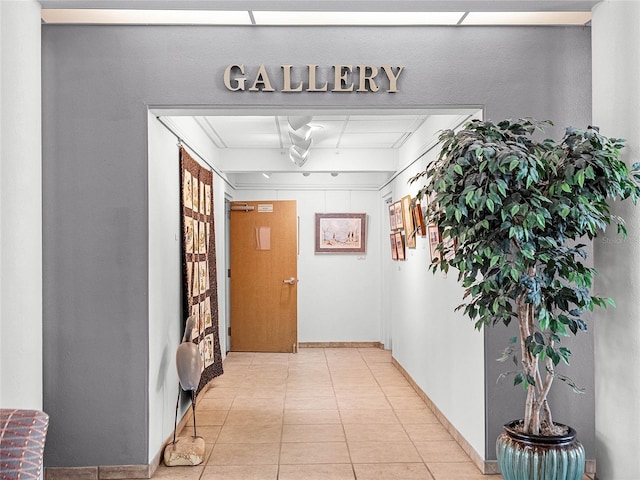 corridor featuring light tile patterned floors