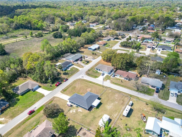 bird's eye view featuring a forest view