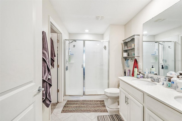 full bath featuring a stall shower, a sink, and double vanity