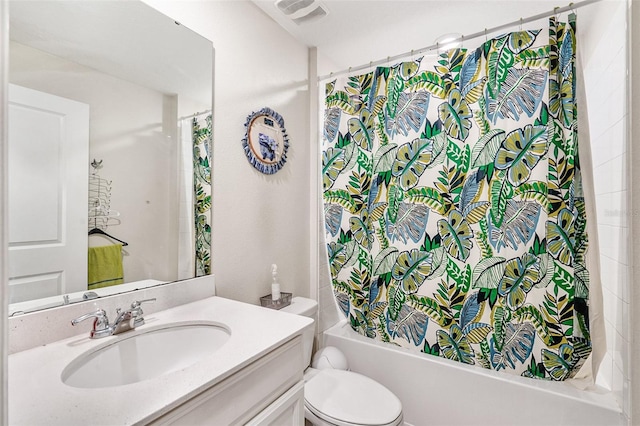 full bath featuring visible vents, shower / tub combo, vanity, and toilet