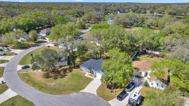 drone / aerial view featuring a view of trees