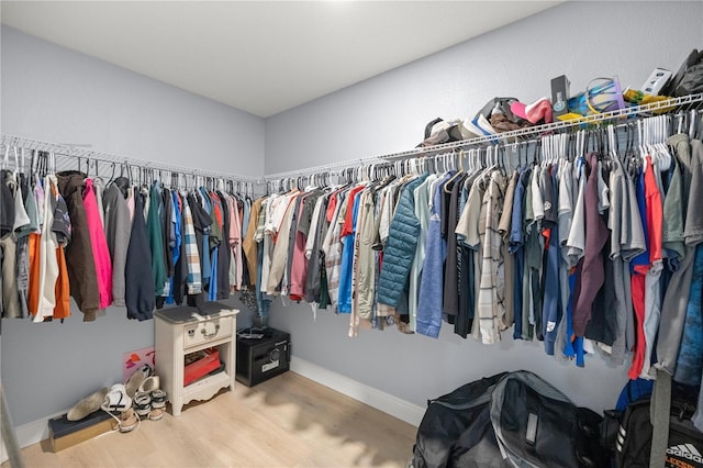 spacious closet featuring wood finished floors