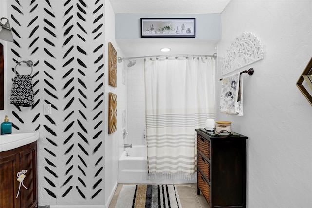 bathroom with shower / bath combo with shower curtain, vanity, and tile patterned flooring